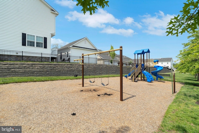 communal playground featuring fence