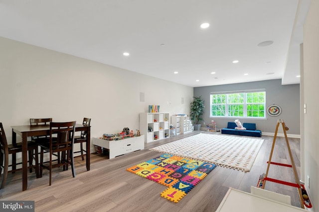 game room featuring wood finished floors and recessed lighting