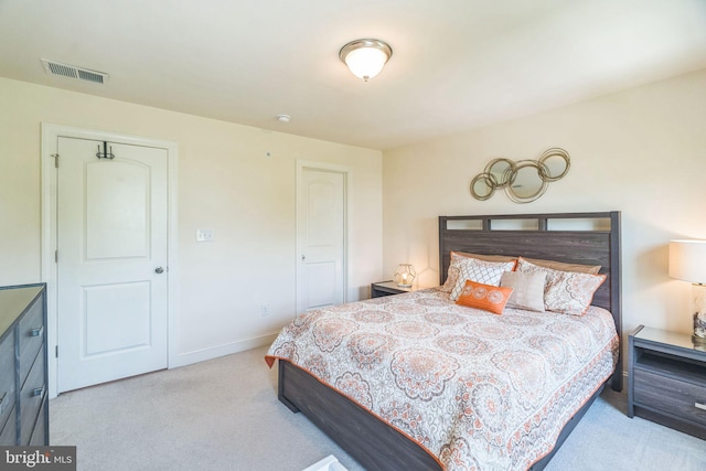 carpeted bedroom featuring baseboards