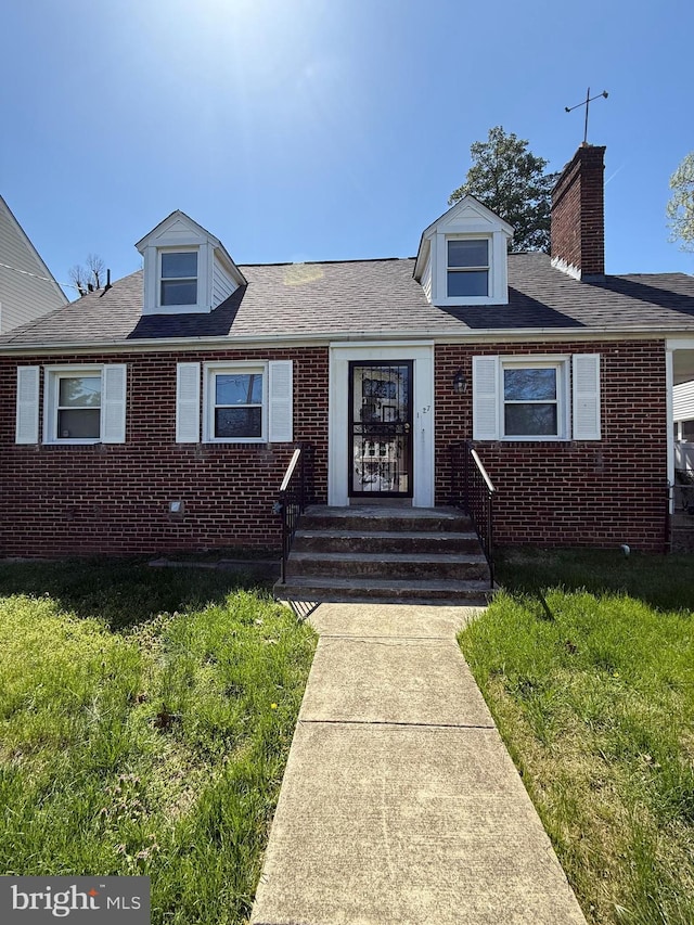 1127 45th Pl SE, Washington, DC 20019 - view of front of property featuring a chimney, brick siding, and a front lawn