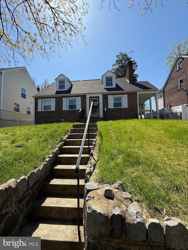 1127 45th Pl SE, Washington, DC 20019 - cape cod home with fence, a chimney, and brick siding