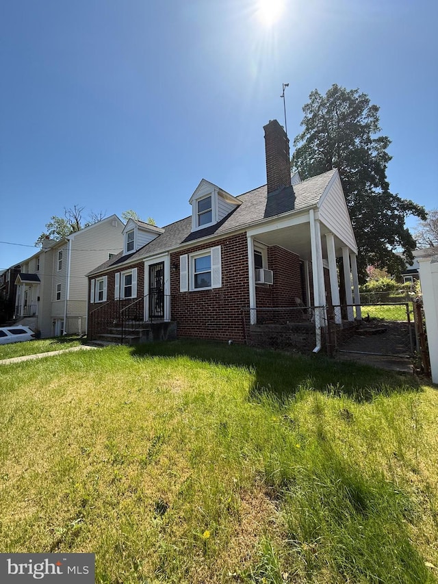 1127 45th Pl SE, Washington, DC 20019 - view of front of home featuring fence, a chimney, brick siding, and a front yard
