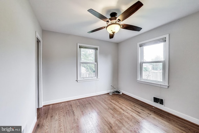 4611 Powder Mill Rd, Beltsville, MD 20705 - spare room featuring baseboards, a ceiling fan, visible vents, and wood finished floors