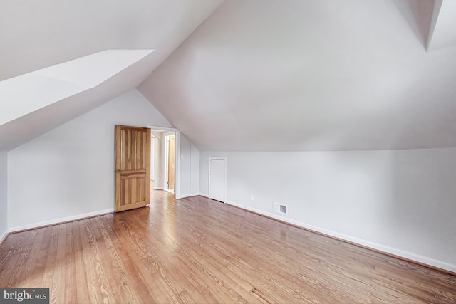 4611 Powder Mill Rd, Beltsville, MD 20705 - additional living space featuring light wood finished floors, lofted ceiling, baseboards, and visible vents