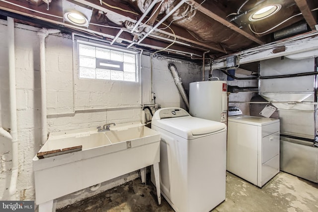 4611 Powder Mill Rd, Beltsville, MD 20705 - washroom featuring electric water heater, laundry area, a sink, and washing machine and clothes dryer