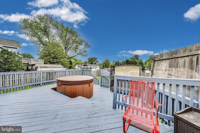 4611 Powder Mill Rd, Beltsville, MD 20705 - wooden deck with an outbuilding, a covered hot tub, a fenced backyard, and a storage unit