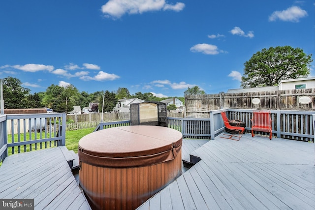 4611 Powder Mill Rd, Beltsville, MD 20705 - wooden terrace with a covered hot tub, a storage unit, an outdoor structure, a fenced backyard, and a yard
