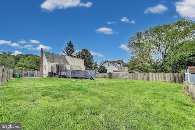 4611 Powder Mill Rd, Beltsville, MD 20705 - view of yard featuring a deck and a fenced backyard