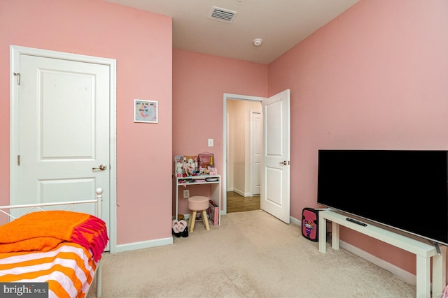 bedroom with carpet floors and baseboards