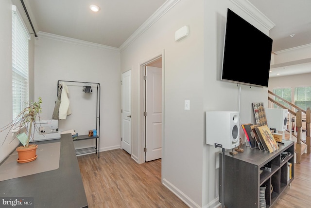 hall with crown molding, light wood-type flooring, baseboards, and recessed lighting