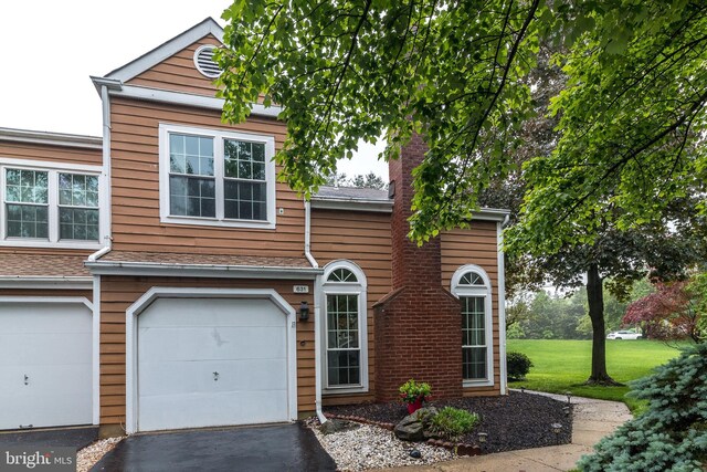 631 Danbury Ct, Newtown, PA 18940 - view of front facade featuring an attached garage, driveway, and a chimney