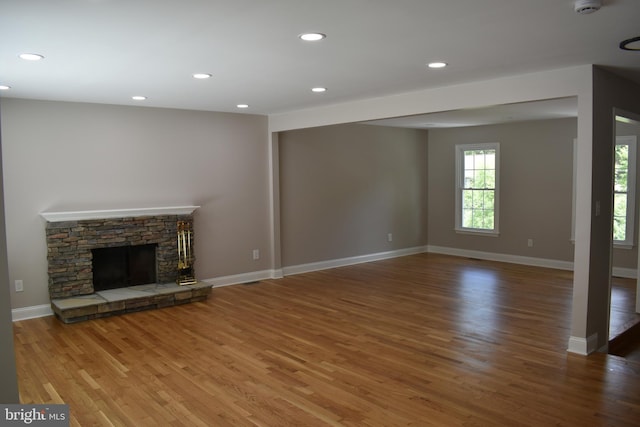 2008 Coast Guard Dr, Stafford, VA 22554 - unfurnished living room featuring wood finished floors, recessed lighting, baseboards, and a fireplace