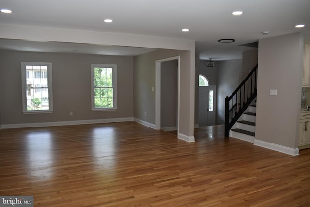 2008 Coast Guard Dr, Stafford, VA 22554 - unfurnished room with wood finished floors, baseboards, recessed lighting, and stairs