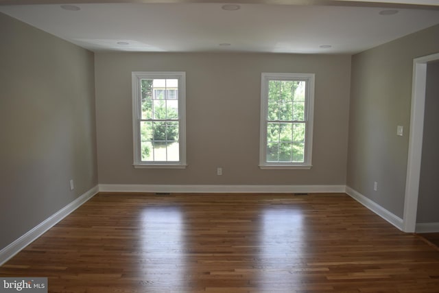 2008 Coast Guard Dr, Stafford, VA 22554 - empty room featuring healthy amount of natural light, wood finished floors, and baseboards