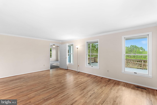 unfurnished living room featuring light wood finished floors, baseboards, ornamental molding, and a ceiling fan