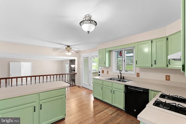 kitchen featuring a sink, dishwasher, and light countertops