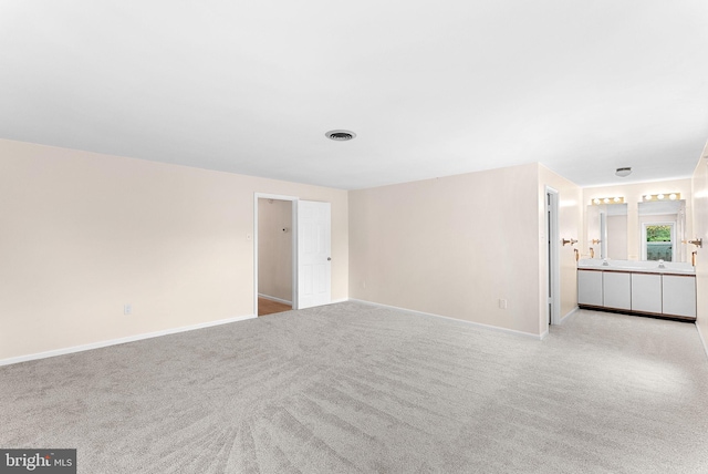 carpeted spare room with baseboards
