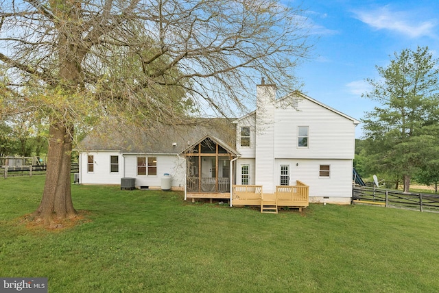 rear view of house with crawl space, a chimney, central AC unit, a sunroom, and a deck