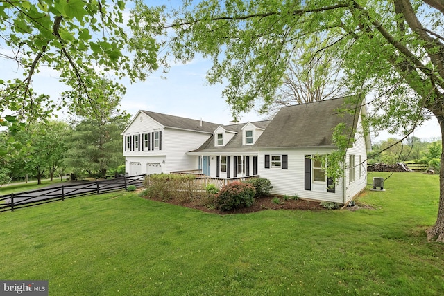 rear view of house featuring a garage