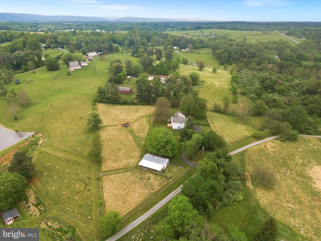 aerial overview of property's location with rural landscape and a large body of water