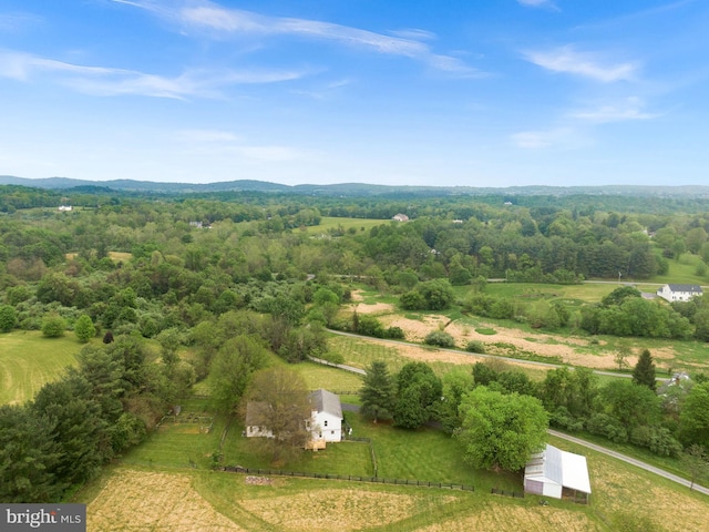 view of rural area featuring a heavily wooded area