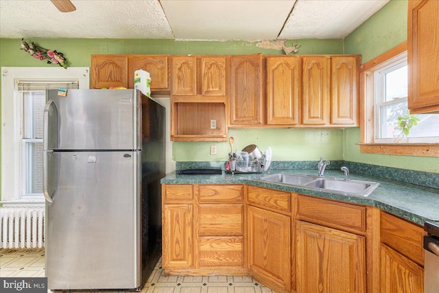 21 W Pall Mall St, Winchester, VA 22601 - kitchen featuring freestanding refrigerator, radiator, a sink, dark countertops, and light floors