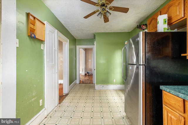 21 W Pall Mall St, Winchester, VA 22601 - kitchen featuring freestanding refrigerator, light floors, baseboards, ceiling fan, and a textured ceiling