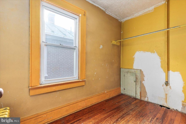 21 W Pall Mall St, Winchester, VA 22601 - unfurnished room with a textured ceiling, wood finished floors, and ornamental molding