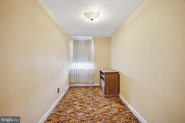 spare room featuring baseboards