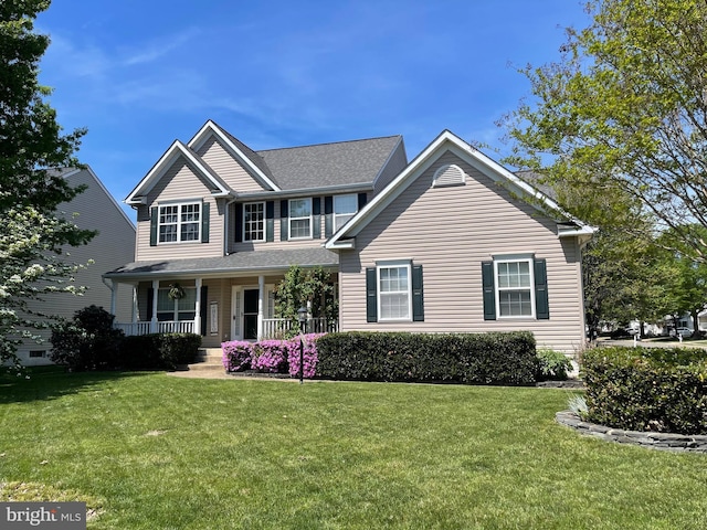 view of front of house with a porch and a front yard