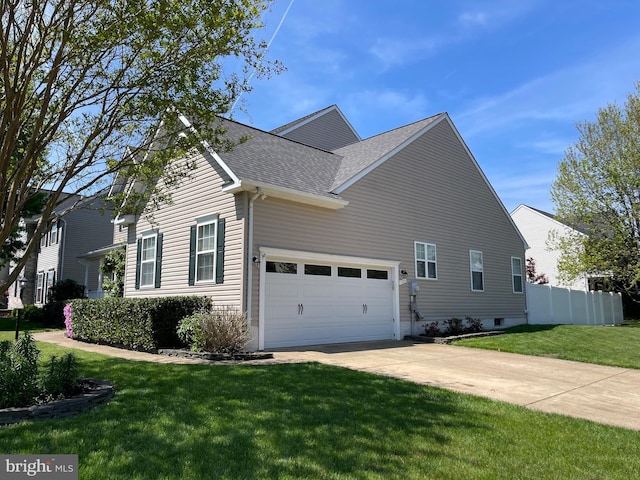 view of property exterior with fence, driveway, a yard, a garage, and a shingled roof