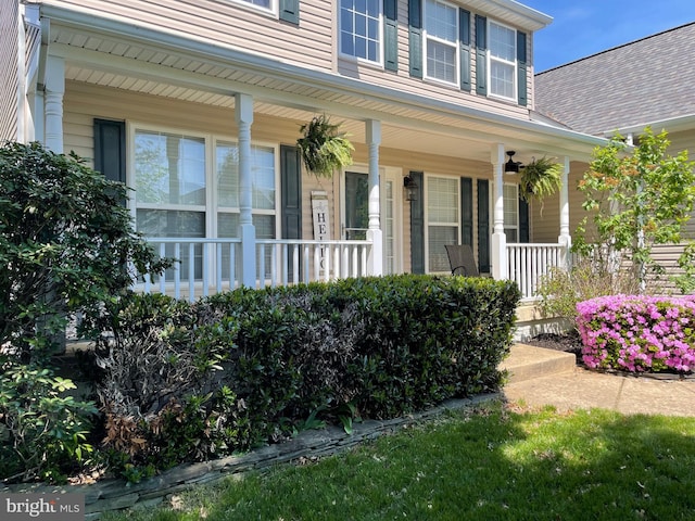 doorway to property featuring a porch