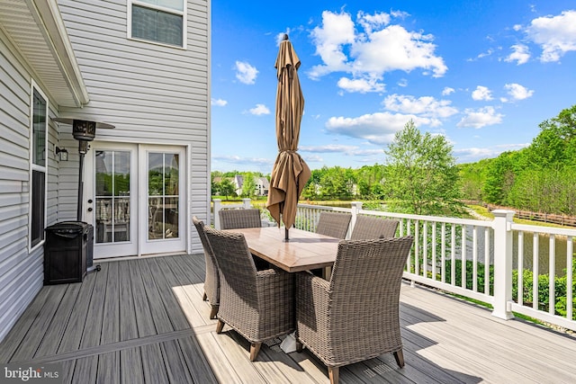 wooden terrace featuring outdoor dining space