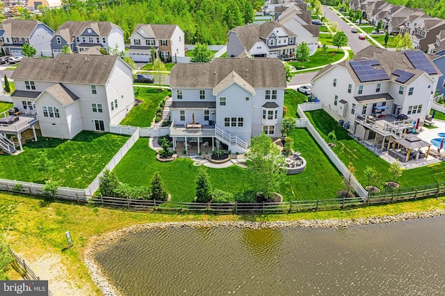 aerial view featuring a water view and a residential view