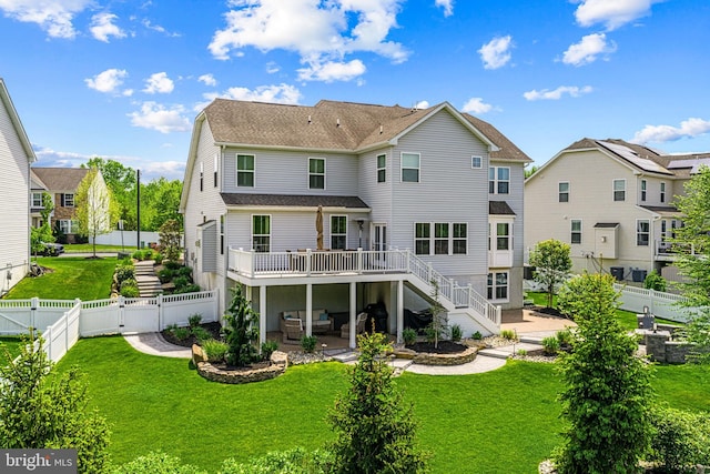 back of property featuring an outdoor living space, a patio area, a deck, a fenced backyard, and a gate