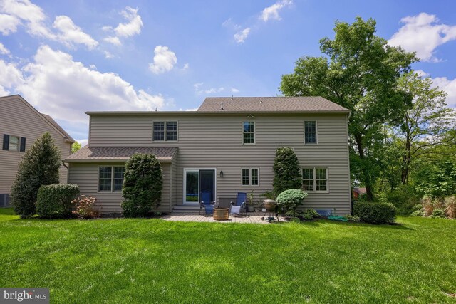 2969 Hearthside Ln, Lancaster, PA 17601 - back of house featuring a yard, a patio, and central AC unit