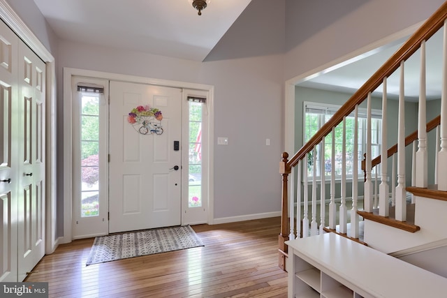 2969 Hearthside Ln, Lancaster, PA 17601 - entrance foyer with hardwood / wood-style floors, plenty of natural light, lofted ceiling, baseboards, and stairway