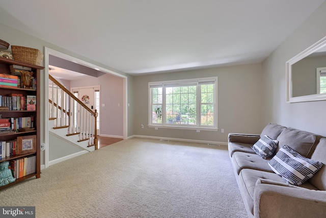 2969 Hearthside Ln, Lancaster, PA 17601 - living room with carpet flooring, stairway, and plenty of natural light