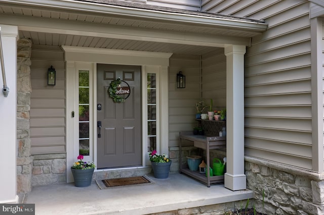 2969 Hearthside Ln, Lancaster, PA 17601 - doorway to property with stone siding and a porch