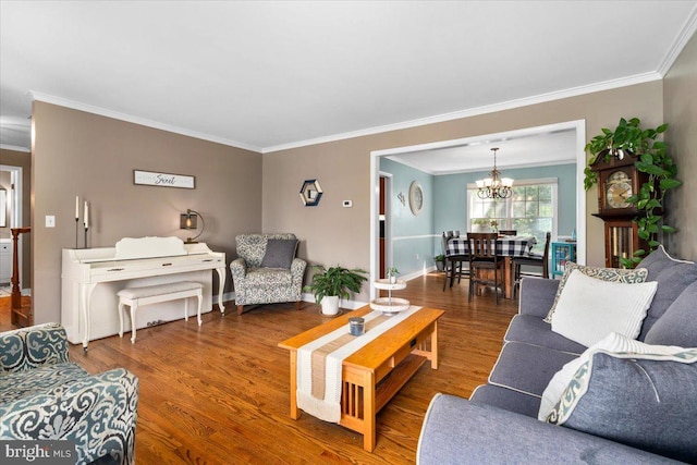 7501 Mason Ct, Middletown, MD 21769 - living room with ornamental molding, a chandelier, wood finished floors, and baseboards