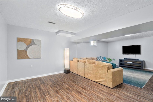 7501 Mason Ct, Middletown, MD 21769 - living area with wood finished floors, a textured ceiling, and baseboards