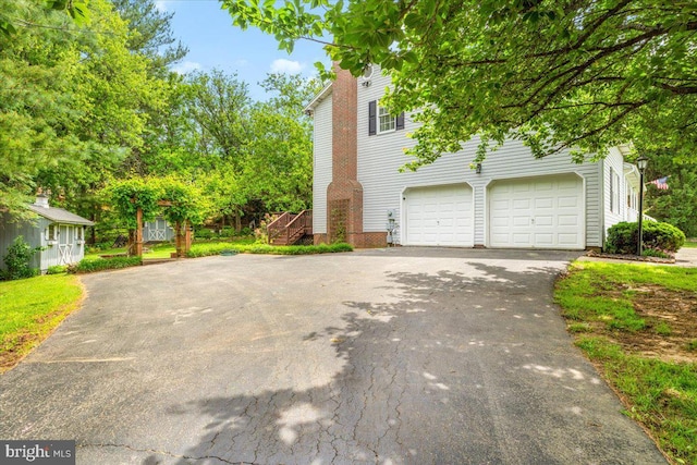 7501 Mason Ct, Middletown, MD 21769 - view of home's exterior featuring asphalt driveway and an attached garage