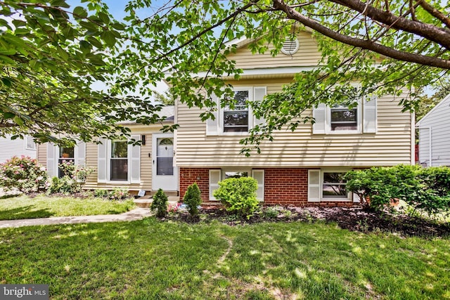 1218 Summerfield Dr, Herndon, VA 20170 - view of front facade featuring a front yard and brick siding