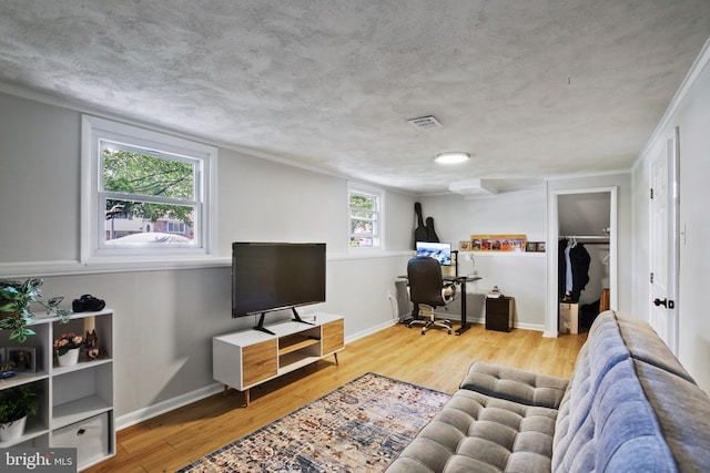 1218 Summerfield Dr, Herndon, VA 20170 - living area featuring wood finished floors, a desk, and baseboards