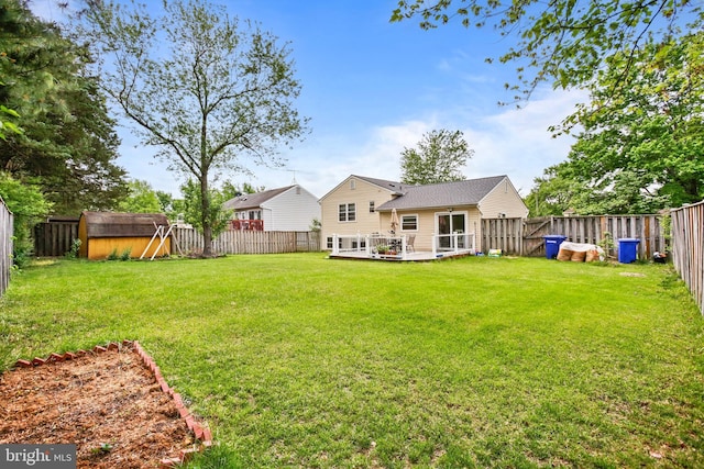 1218 Summerfield Dr, Herndon, VA 20170 - back of house with a storage unit, an outdoor structure, and a wooden deck