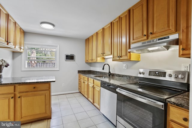 1218 Summerfield Dr, Herndon, VA 20170 - kitchen with stainless steel appliances, under cabinet range hood, a sink, light tile patterned floors, and dark stone countertops