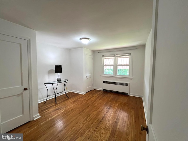 600 W 32nd St, Wilmington, DE 19802 - unfurnished room with radiator heating unit and wood finished floors