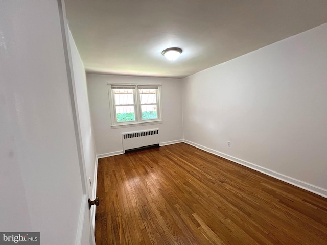 600 W 32nd St, Wilmington, DE 19802 - unfurnished room featuring radiator and dark wood-type flooring