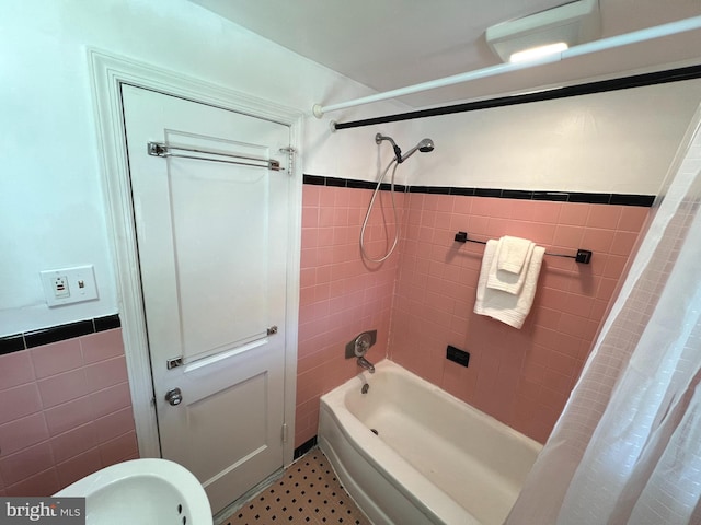 600 W 32nd St, Wilmington, DE 19802 - bathroom with tile walls, shower / tub combo, and a wainscoted wall