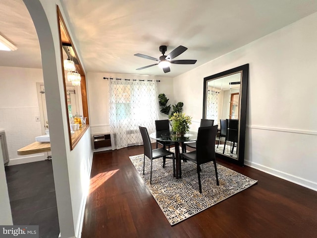 600 W 32nd St, Wilmington, DE 19802 - dining space with arched walkways, dark wood-style floors, a ceiling fan, and a wall mounted air conditioner